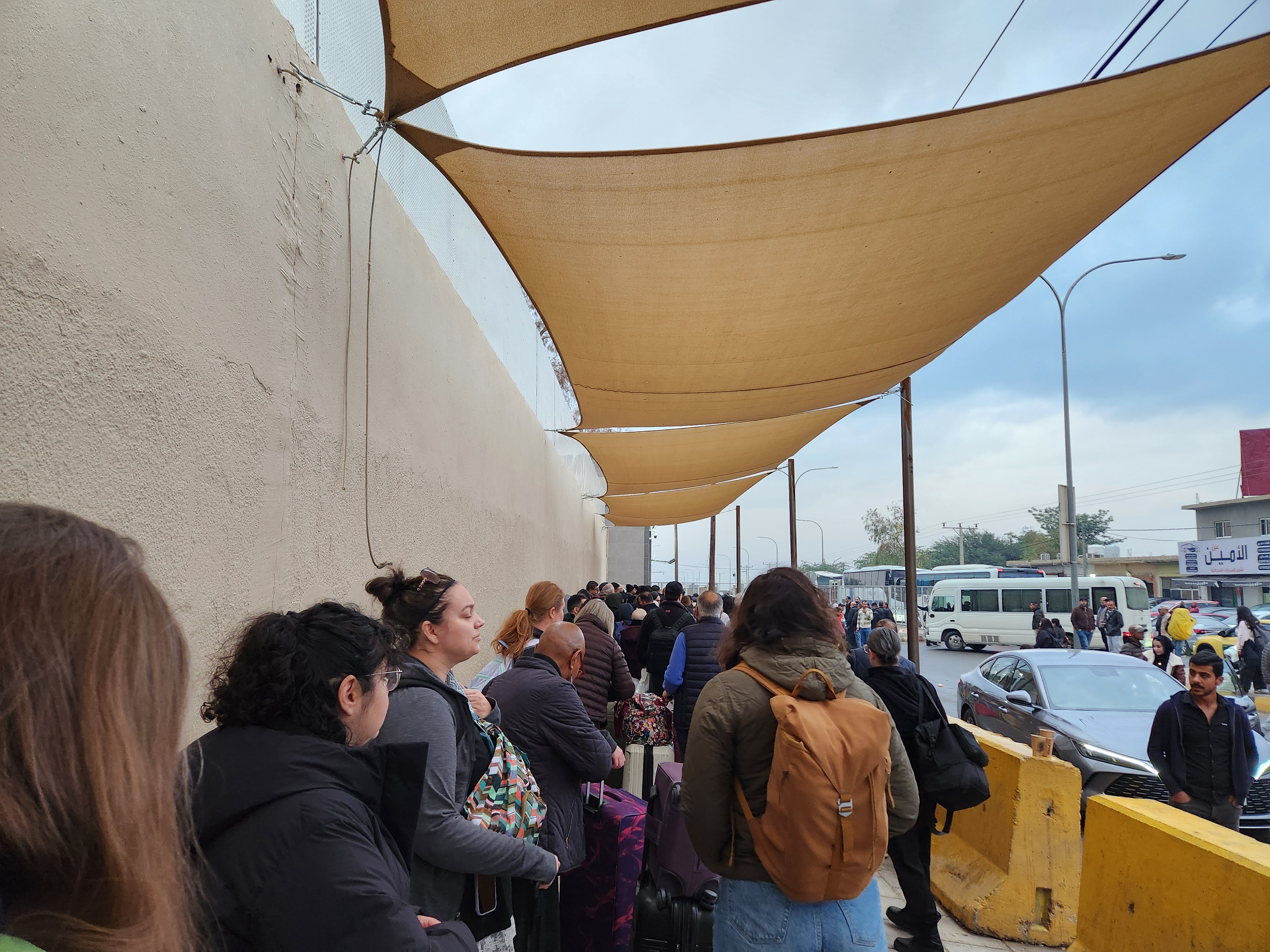 People at militarized border crossing from Jordan to West Bank