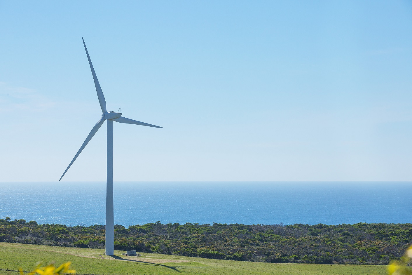 A drive through wind farm country on a sunny day