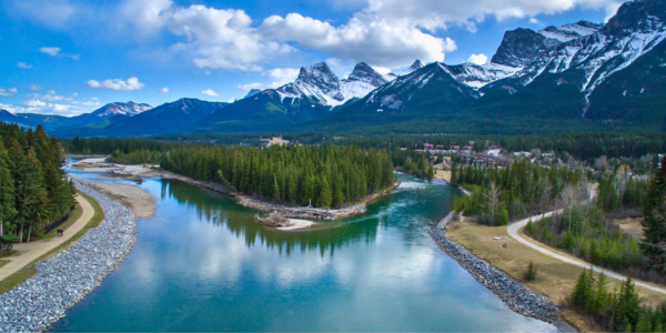 Bow River and Rocky Mountains A view of the Bow River and Rocky Mountains in Canmore, Alberta. Shutterstock photo.