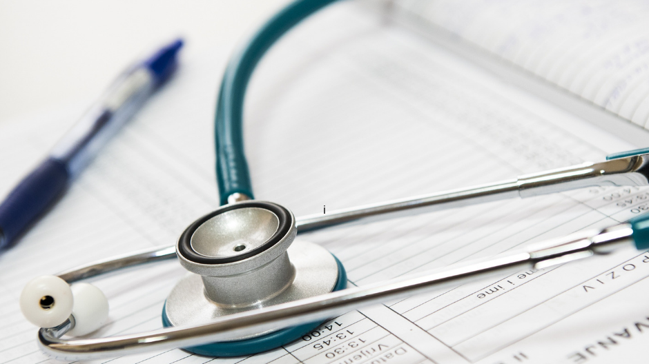 A stethoscope draped over a medical chart