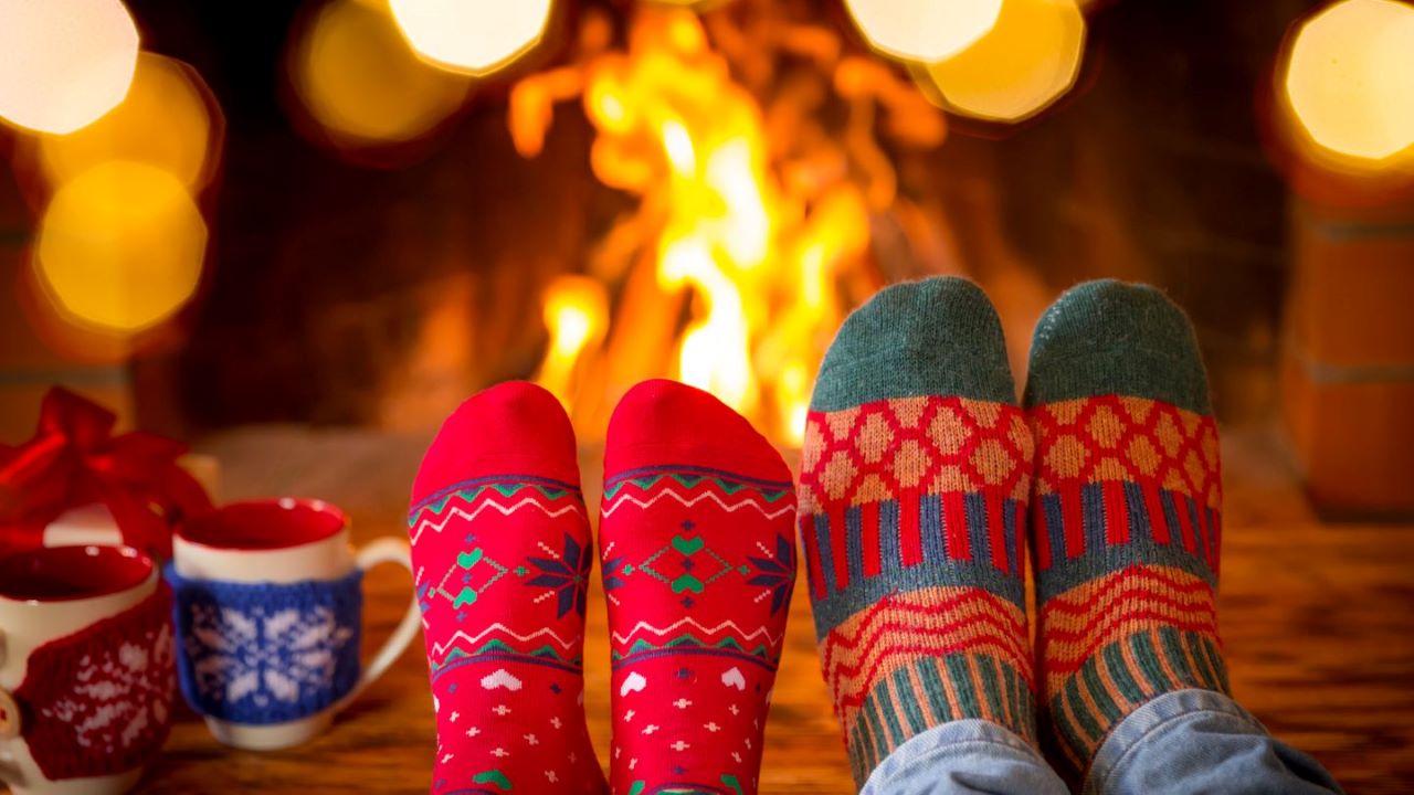 sock feet in front of fire